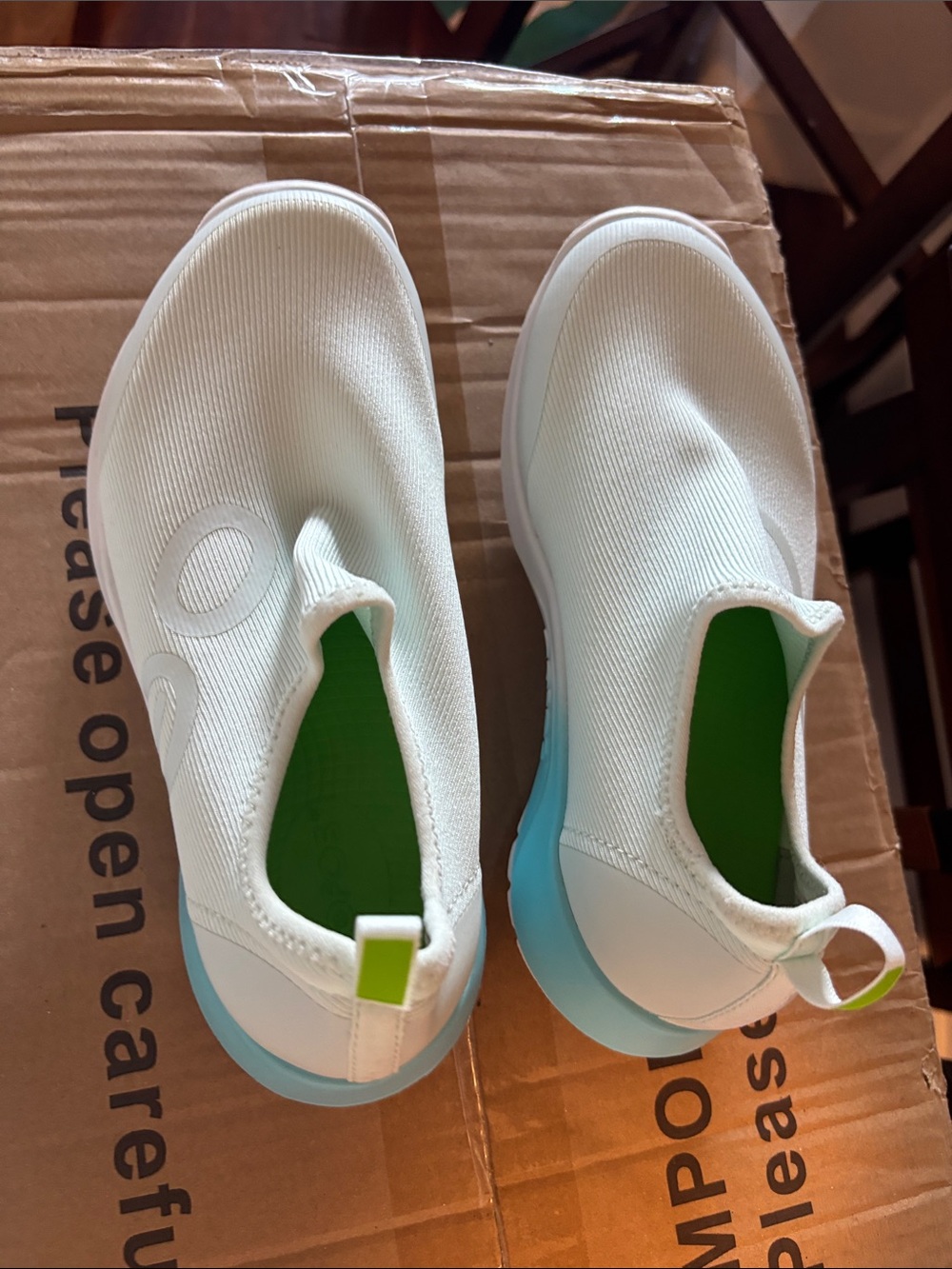 OOFOS White Slip-On Sneakers with Aqua Sole and Lime Accent
